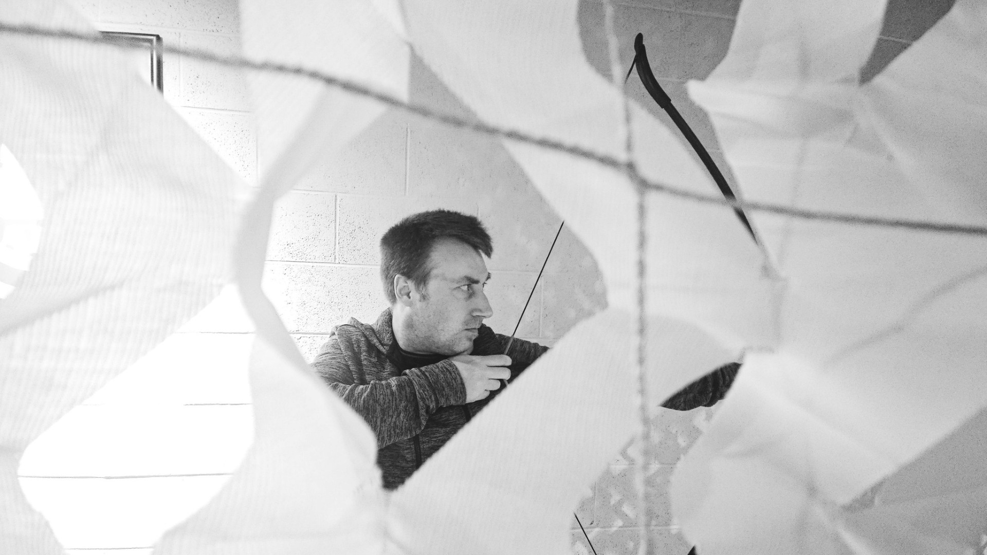 Ben Albiston, independent UK developer, drawing a recurve bow